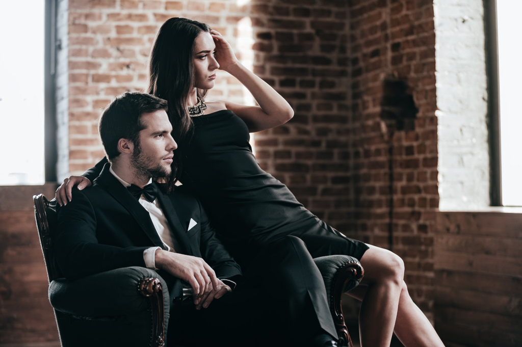 elegant couple posing in black attire indoors 2026 03 24 10 22 06 utc